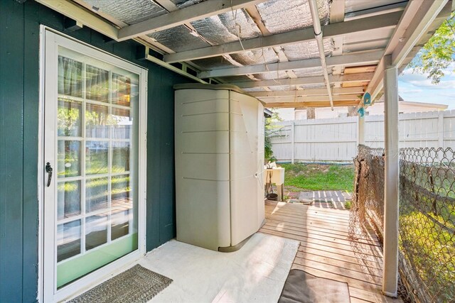 view of patio featuring a pergola and a deck