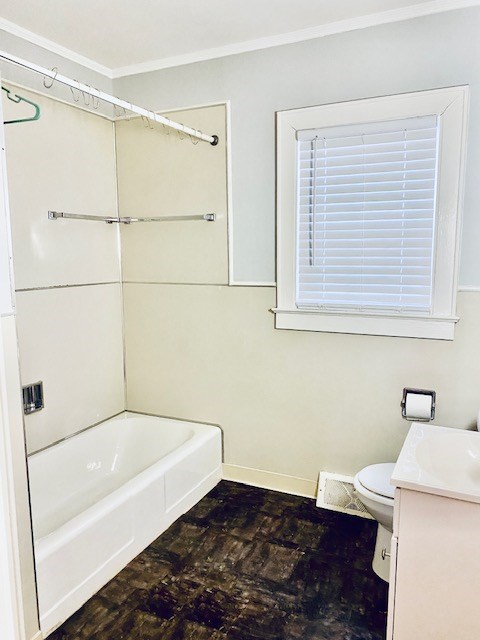 full bathroom with vanity, ornamental molding, toilet, and shower / washtub combination