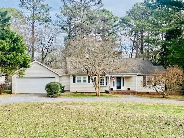 view of front of house featuring a garage and a front yard