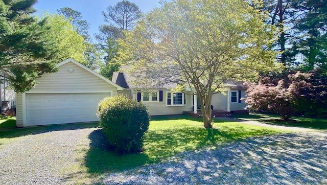 715 Ridgewood Ln, Dalton, GA 30720 - ranch-style house featuring a garage, a front yard, driveway, and a chimney