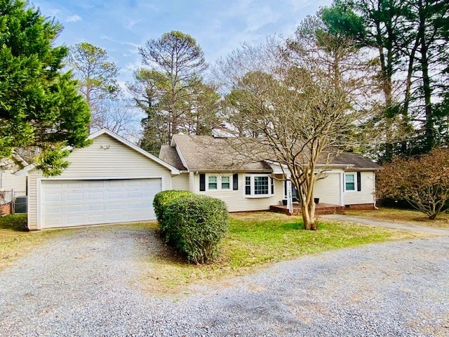 single story home with a garage