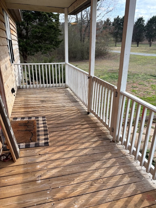 wooden deck featuring covered porch