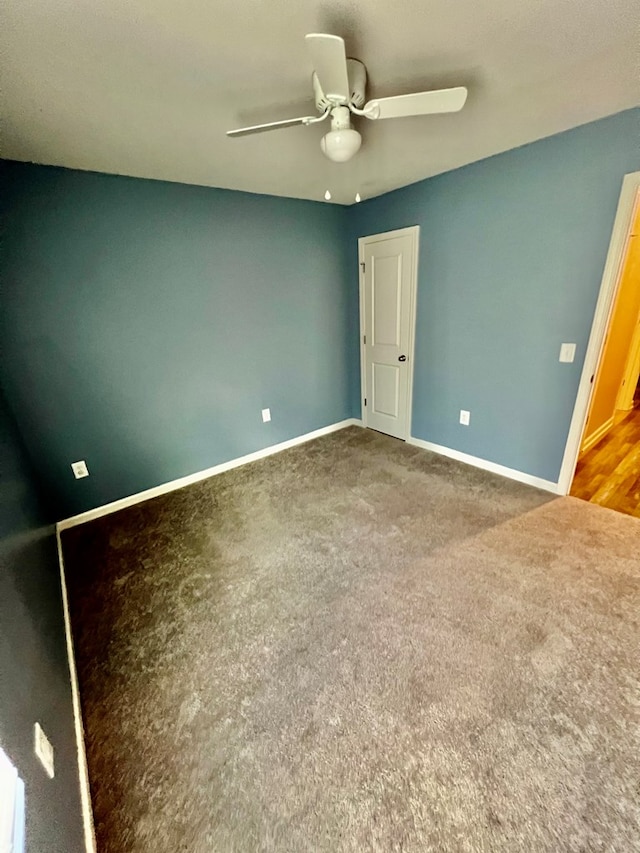 unfurnished bedroom with carpet, baseboards, and a ceiling fan
