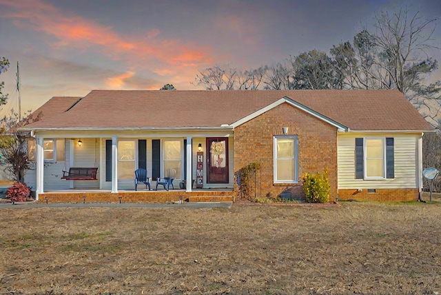 view of front of property with a yard and a porch