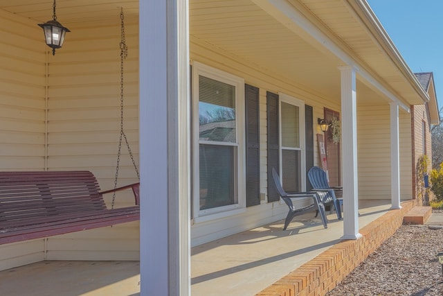 view of patio featuring a porch