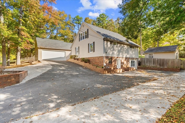 view of side of home featuring a garage