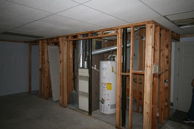 basement featuring gas water heater and a paneled ceiling