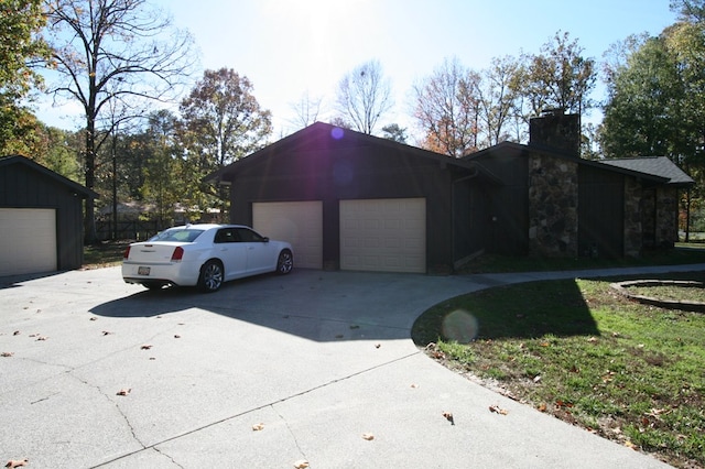 view of front facade with a garage and an outdoor structure