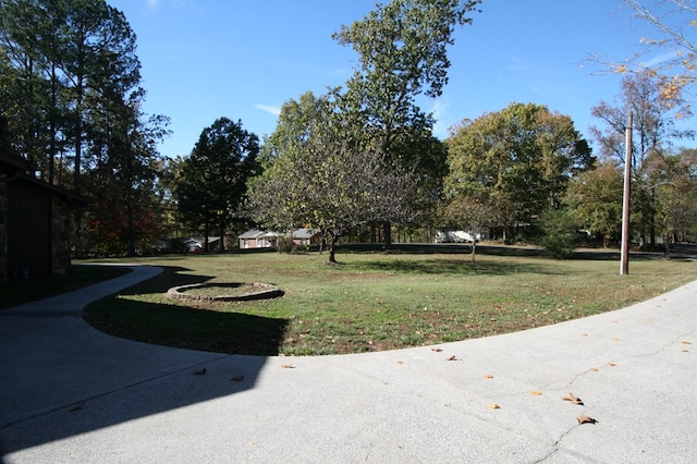 view of property's community with a yard