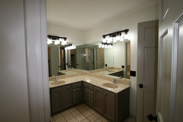 bathroom with tile patterned flooring and vanity