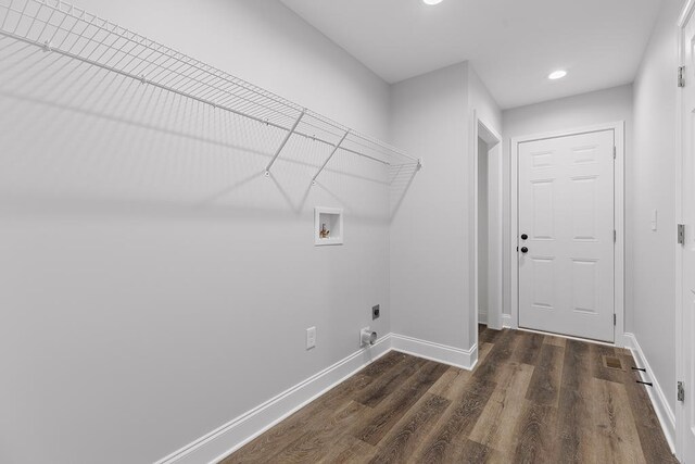 clothes washing area with washer hookup, electric dryer hookup, and dark hardwood / wood-style floors