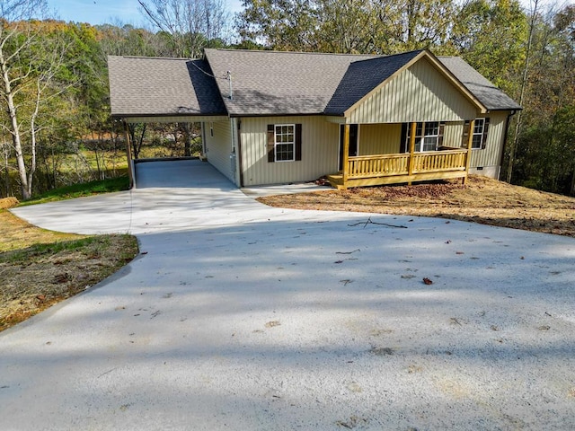 single story home featuring a carport and covered porch