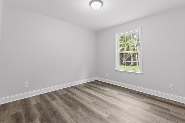 spare room featuring hardwood / wood-style floors