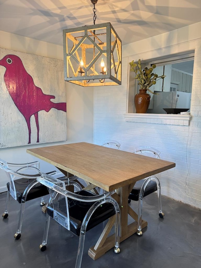 dining space featuring an inviting chandelier