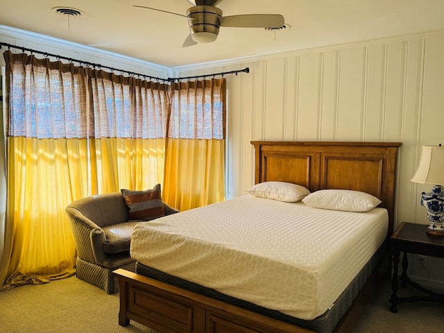 bedroom featuring crown molding, carpet floors, and ceiling fan