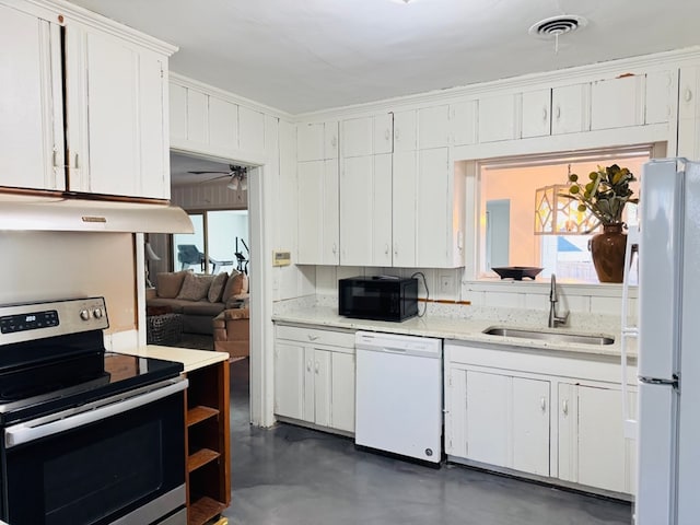 kitchen featuring ornamental molding, sink, white cabinets, and white appliances