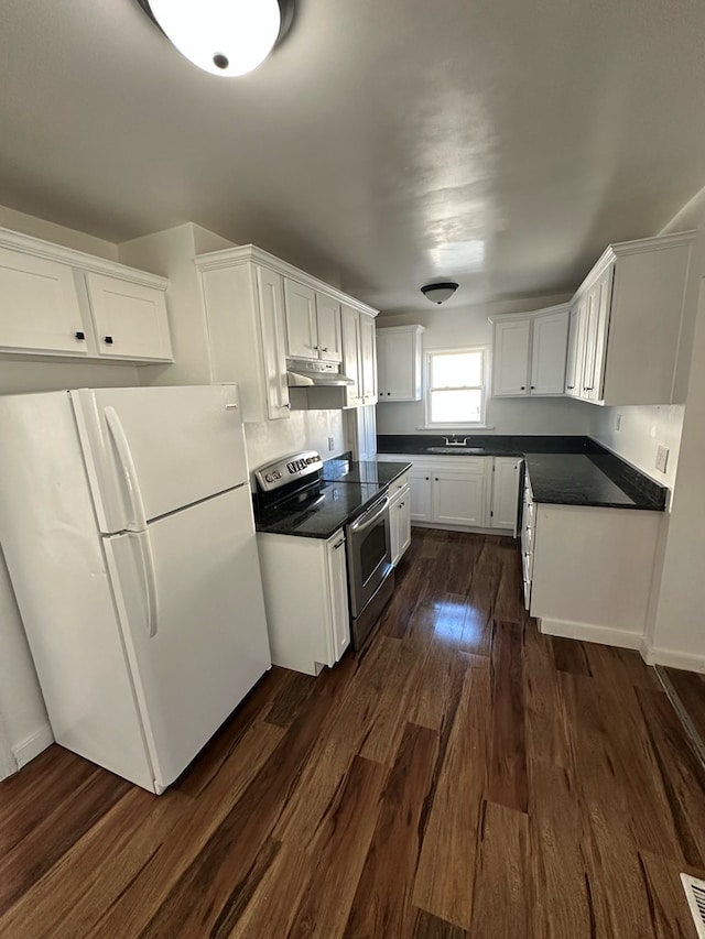 kitchen featuring sink, dark hardwood / wood-style floors, white fridge, electric stove, and white cabinets