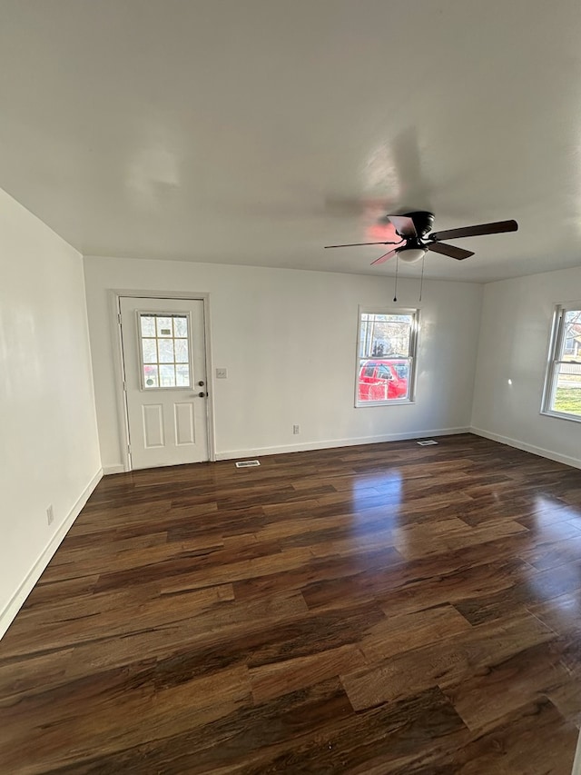 interior space featuring dark hardwood / wood-style floors and ceiling fan