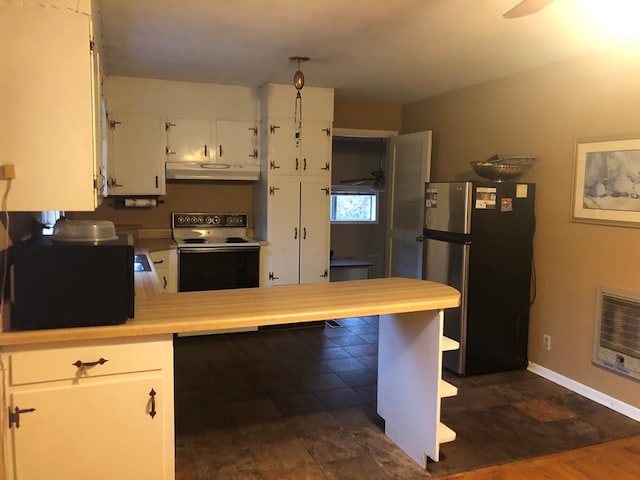 kitchen with white cabinetry, heating unit, range with electric cooktop, and stainless steel refrigerator