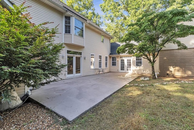 299 Charlotte Dr, Dalton, GA 30720 - back of house featuring french doors, a patio, a shingled roof, and a lawn