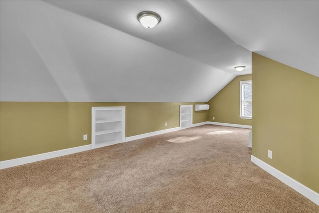 299 Charlotte Dr, Dalton, GA 30720 - bonus room featuring carpet floors, built in features, and vaulted ceiling