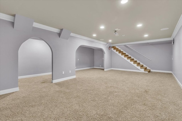 299 Charlotte Dr, Dalton, GA 30720 - unfurnished living room with ornamental molding, arched walkways, recessed lighting, carpet flooring, and stairway