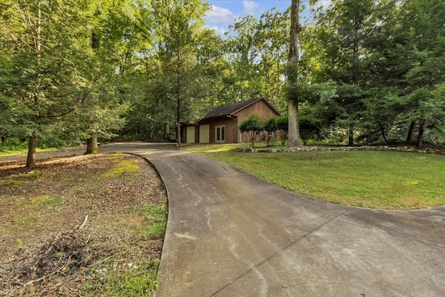 299 Charlotte Dr, Dalton, GA 30720 - view of front of property featuring concrete driveway, a front yard, and a garage
