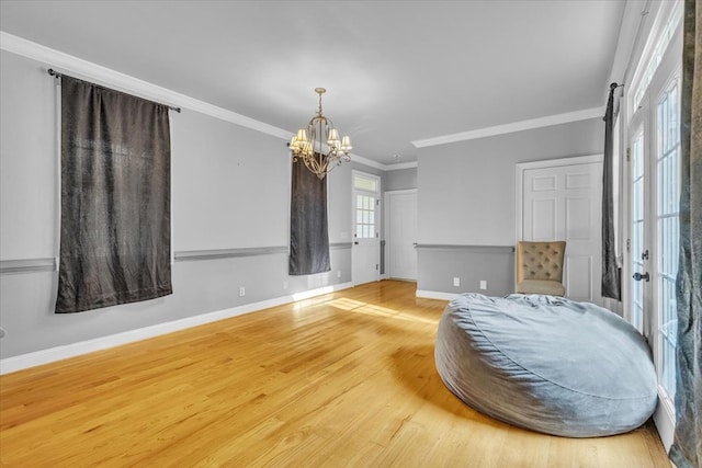 299 Charlotte Dr, Dalton, GA 30720 - bedroom with a chandelier, wood finished floors, and ornamental molding