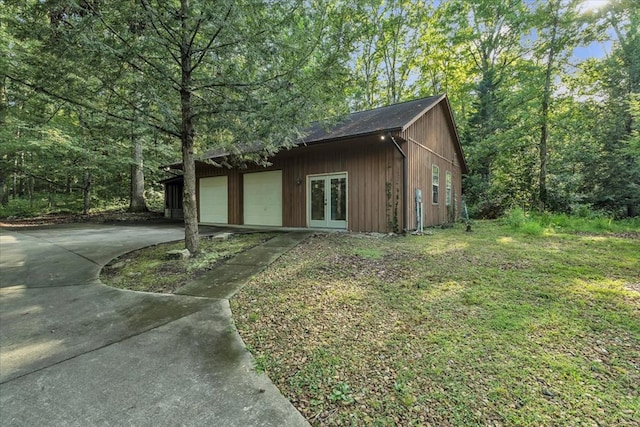 299 Charlotte Dr, Dalton, GA 30720 - view of home's exterior featuring french doors, concrete driveway, and an attached garage