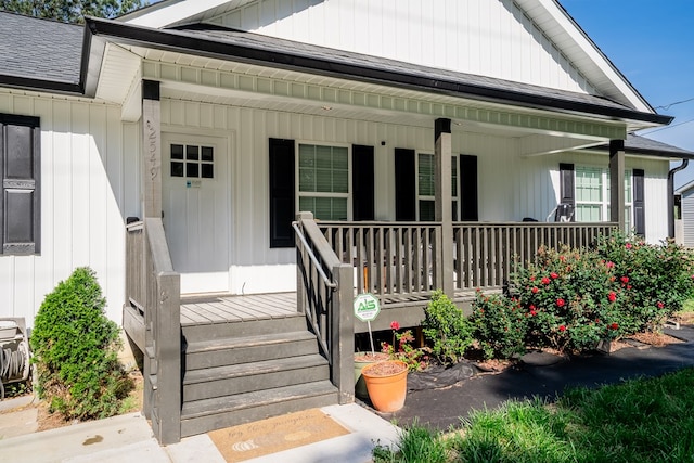 2549 Prospect Rd, Dalton, GA 30721 - view of exterior entry featuring a porch, roof with shingles, and board and batten siding