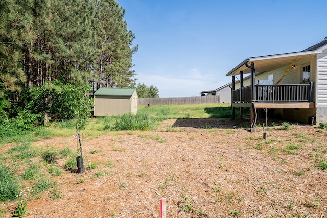 2549 Prospect Rd, Dalton, GA 30721 - view of yard with a storage shed, a wooden deck, and an outdoor structure