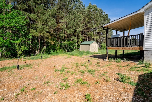 2549 Prospect Rd, Dalton, GA 30721 - view of yard with an outdoor structure, a deck, and a shed