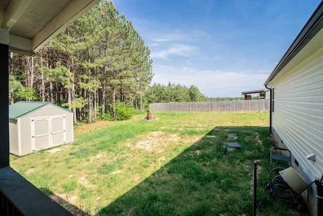 2549 Prospect Rd, Dalton, GA 30721 - view of yard featuring a storage shed, fence, and an outdoor structure