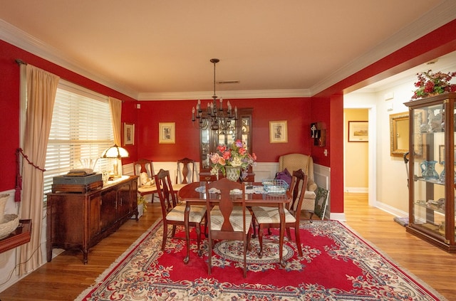 1730 Brighton Way, Dalton, GA 30720 - dining area with wood finished floors, a chandelier, crown molding, and a wainscoted wall