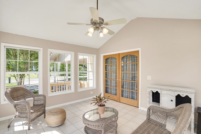 sunroom / solarium with lofted ceiling, french doors, and ceiling fan