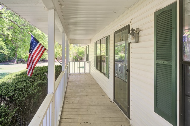 wooden terrace with a porch