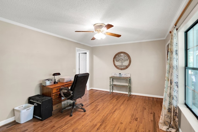 office featuring crown molding, ceiling fan, hardwood / wood-style floors, and a textured ceiling