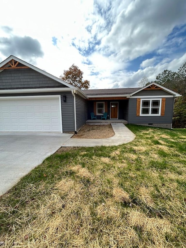 single story home with a garage and a front yard