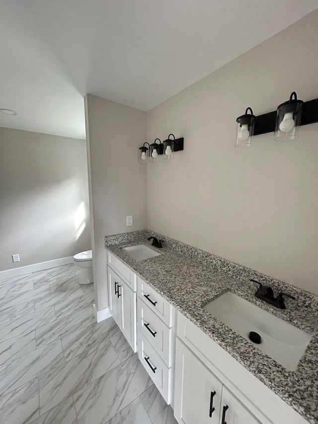 bathroom with vanity and toilet