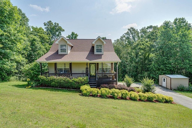 1359 Dustin Dr, Dalton, GA 30720 - cape cod home with a front lawn, covered porch, and an outdoor structure