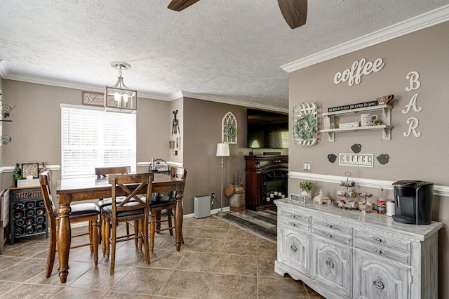 1359 Dustin Dr, Dalton, GA 30720 - tiled dining room with a textured ceiling, crown molding, a fireplace, and ceiling fan