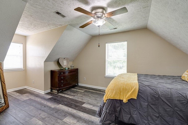 1359 Dustin Dr, Dalton, GA 30720 - bedroom featuring wood finished floors, a textured ceiling, lofted ceiling, multiple windows, and ceiling fan