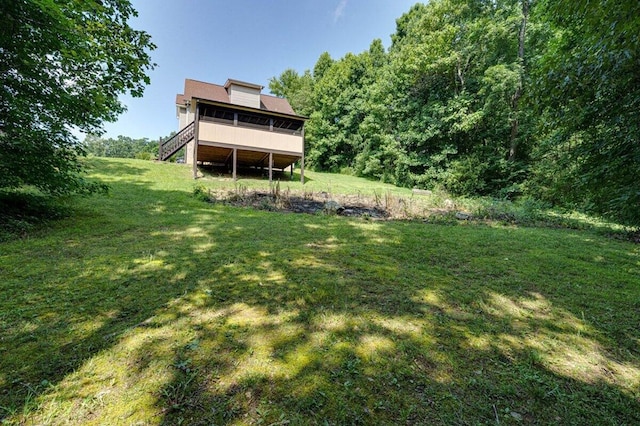 1359 Dustin Dr, Dalton, GA 30720 - rear view of house featuring a sunroom and a lawn