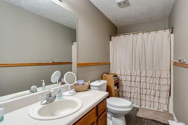 1359 Dustin Dr, Dalton, GA 30720 - full bath with vanity, a textured ceiling, wood finished floors, and a shower with curtain