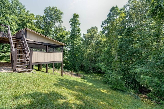 1359 Dustin Dr, Dalton, GA 30720 - view of grassy yard featuring stairway, a sunroom, and a deck