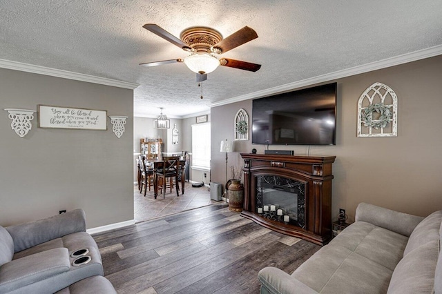 1359 Dustin Dr, Dalton, GA 30720 - living area featuring ceiling fan, wood finished floors, a textured ceiling, crown molding, and a fireplace