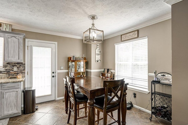 1359 Dustin Dr, Dalton, GA 30720 - dining area featuring plenty of natural light, a chandelier, crown molding, and a textured ceiling
