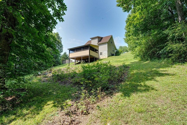 1359 Dustin Dr, Dalton, GA 30720 - view of green lawn with a deck and a sunroom