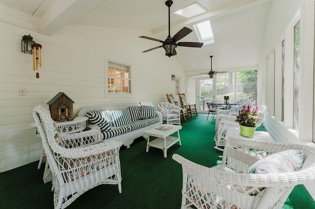 sunroom / solarium with vaulted ceiling with skylight and ceiling fan