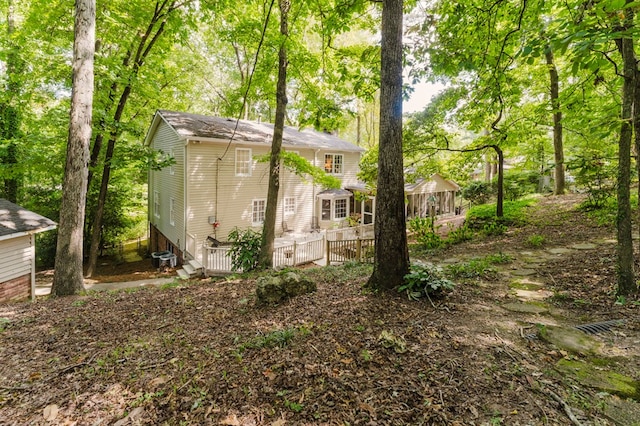 view of outdoor structure featuring a sunroom